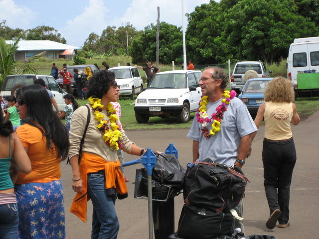 image of tourists in flower necklaces