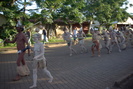 Image of painted people pulling a Moai