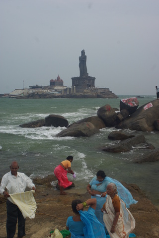 Image of Thiruvalluvar statue, rocks and people